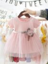 Adorable little girl twirling in a pink Summer Bloom Rose Princess Dress from Newness showcasing its comfortable and stylish design