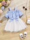 Adorable baby girl wearing a cute and playful summer stripe sundress perfect for playtime