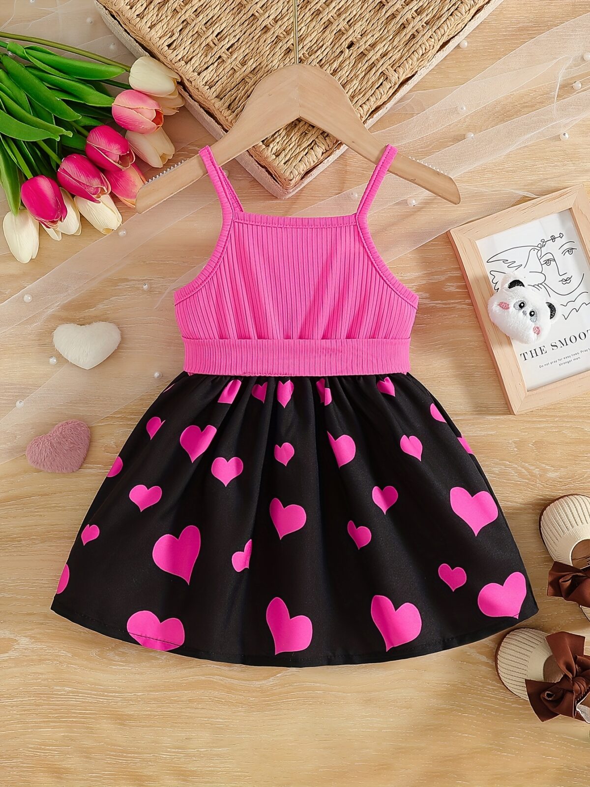 Sweetheart Summer Toddler Dress   Adorable little girl wearing a charming pink and white summer dress perfect for summer parties and outdoor play