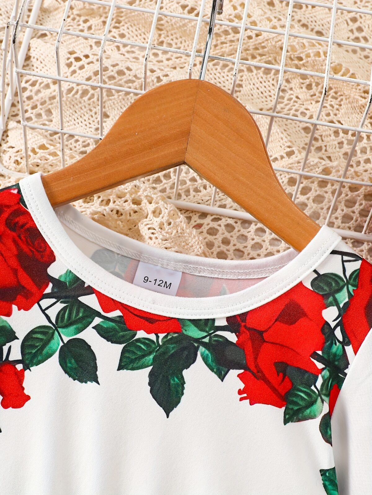 Adorable baby girl wearing a rose garden print dress perfect for fall and winter