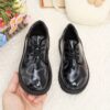 Adorable baby boy wearing stylish and comfortable Newness Little Gentleman shoes
