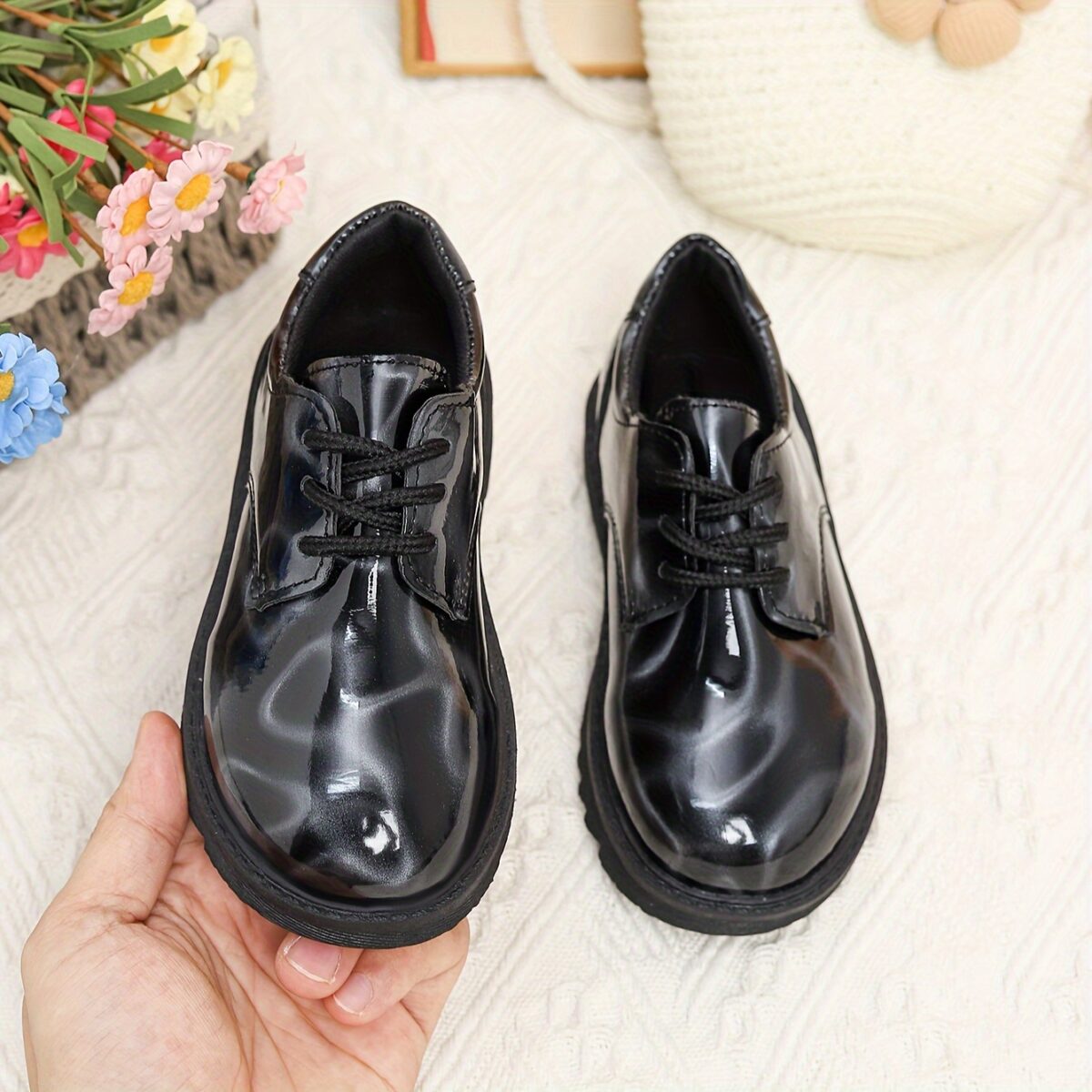 Adorable baby boy wearing stylish and comfortable Newness Little Gentleman shoes