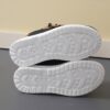 Stylish and comfortable blue canvas sneakers for boys perfect for playtime The shoes feature a classic design with durable construction