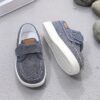 Stylish and comfortable blue canvas shoes for boys perfect for everyday wear The shoes feature a classic design with a touch of modern style