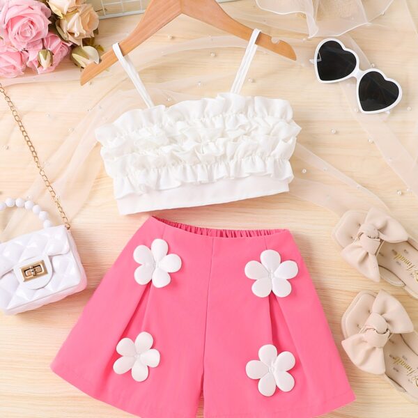 Adorable Summer Bloom Girls Shorts Set in a cheerful floral print, perfect for sunny summer days. The set includes a top and shorts.