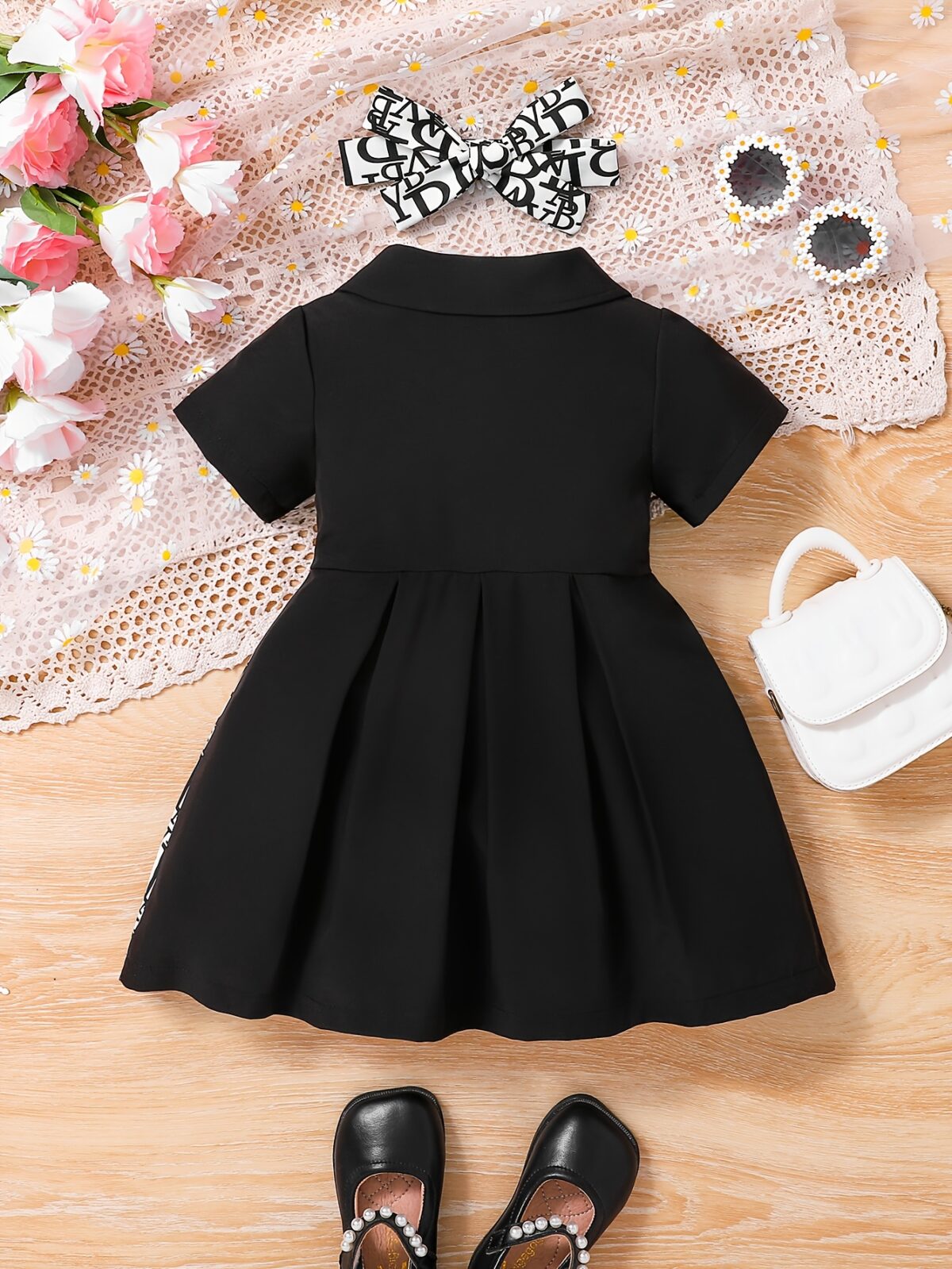Adorable baby girl in a stylish and comfortable summer dress from Newness perfect for a playdate