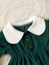 Adorable Emerald Isle doll collar dress and hat set in emerald green perfect for your little one The dress features a charming doll collar and the matching hat completes the outfit
