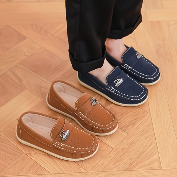 Stylish and comfortable Newness Classic Boys Loafers perfect for any occasion A close up shot showcasing the loafers design and quality