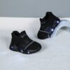Glowing Cloud Kids Slip On Sneakers in action A childs feet wearing the stylish and comfortable Newness slip on sneakers ready for play The shoes are light colored and feature a unique design