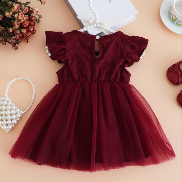 Adorable girl wearing a beautiful summer bloom floral print dress perfect for parties and casual wear