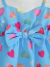 Adorable baby girl wearing a summer heart print dress perfect for school and special occasions