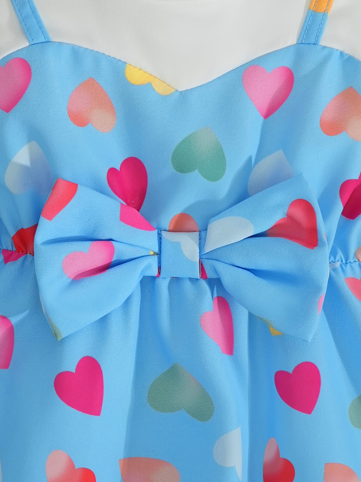 Adorable baby girl wearing a summer heart print dress perfect for school and special occasions
