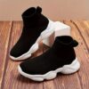 Stylish and comfortable Newness Cloudwalkers Kids High Tops in action perfect for active play A childs feet are shown wearing the high top sneakers while engaged in energetic activity
