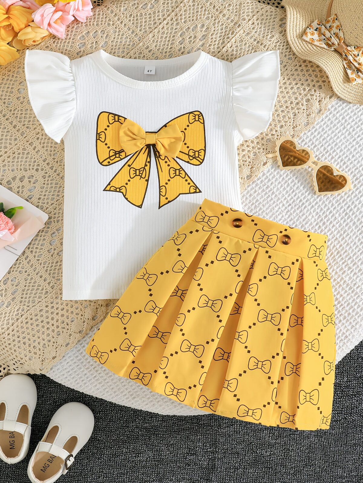 Adorable girls summer outfit Newnesss Summer Playdate Bow Skirt Set A charming two piece set featuring a stylish bow skirt and coordinating top
