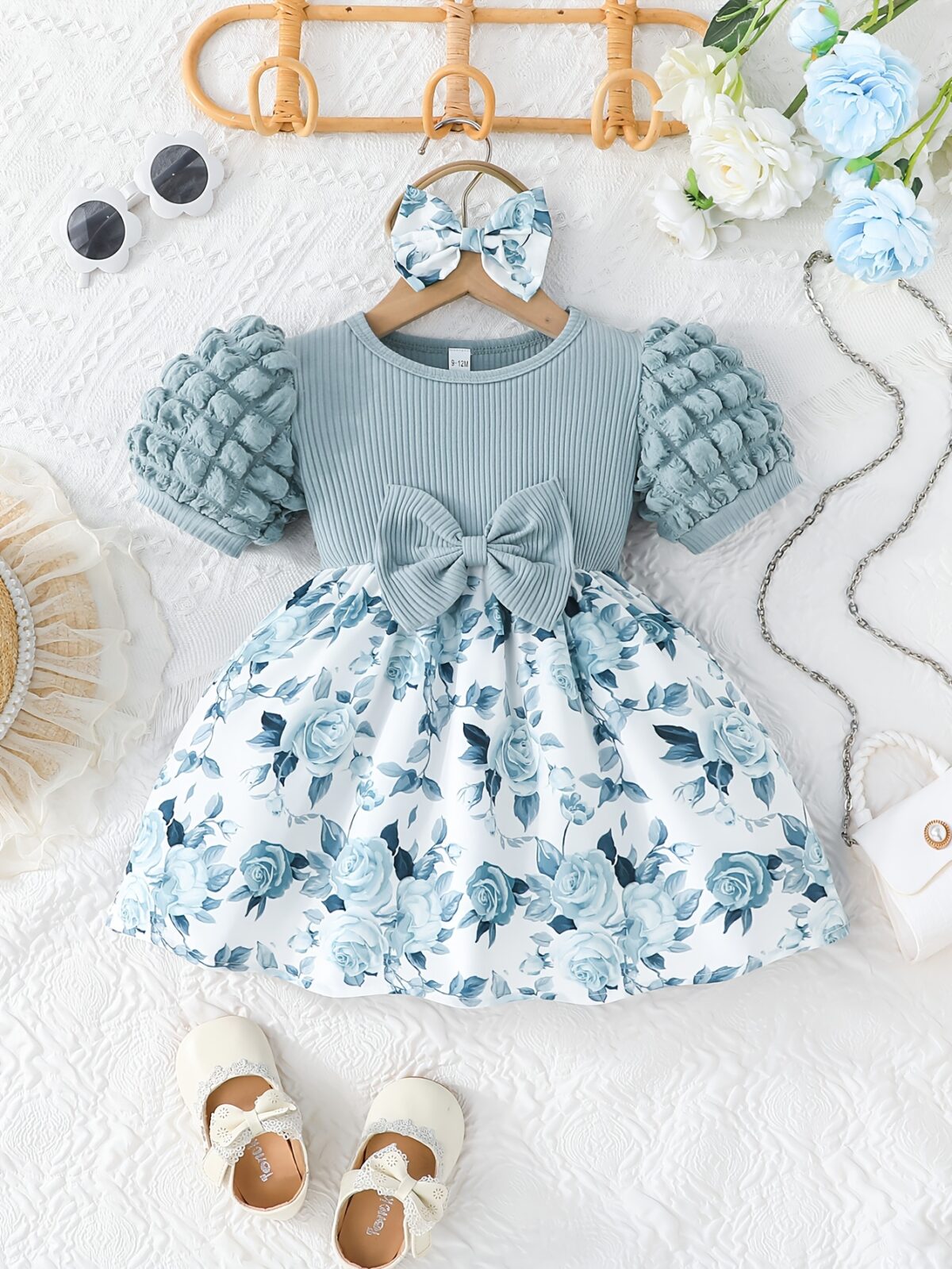 Adorable baby girl wearing a charming Seraphina floral print dress perfect for summer