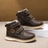Child wearing stylish and warm Newness Adventure Ready Kids Snow Boots playing in the snow