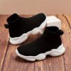 Stylish and comfortable Newness Cloudwalkers Kids High Tops in action perfect for active play A childs feet are shown wearing the high top sneakers while engaged in energetic activity