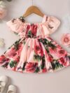 Adorable little girl twirling in a beautiful rose garden floral print dress Perfect summer outfit for kids