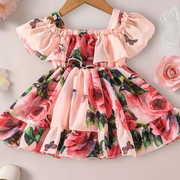 Adorable little girl twirling in a beautiful rose garden floral print dress Perfect summer outfit for kids