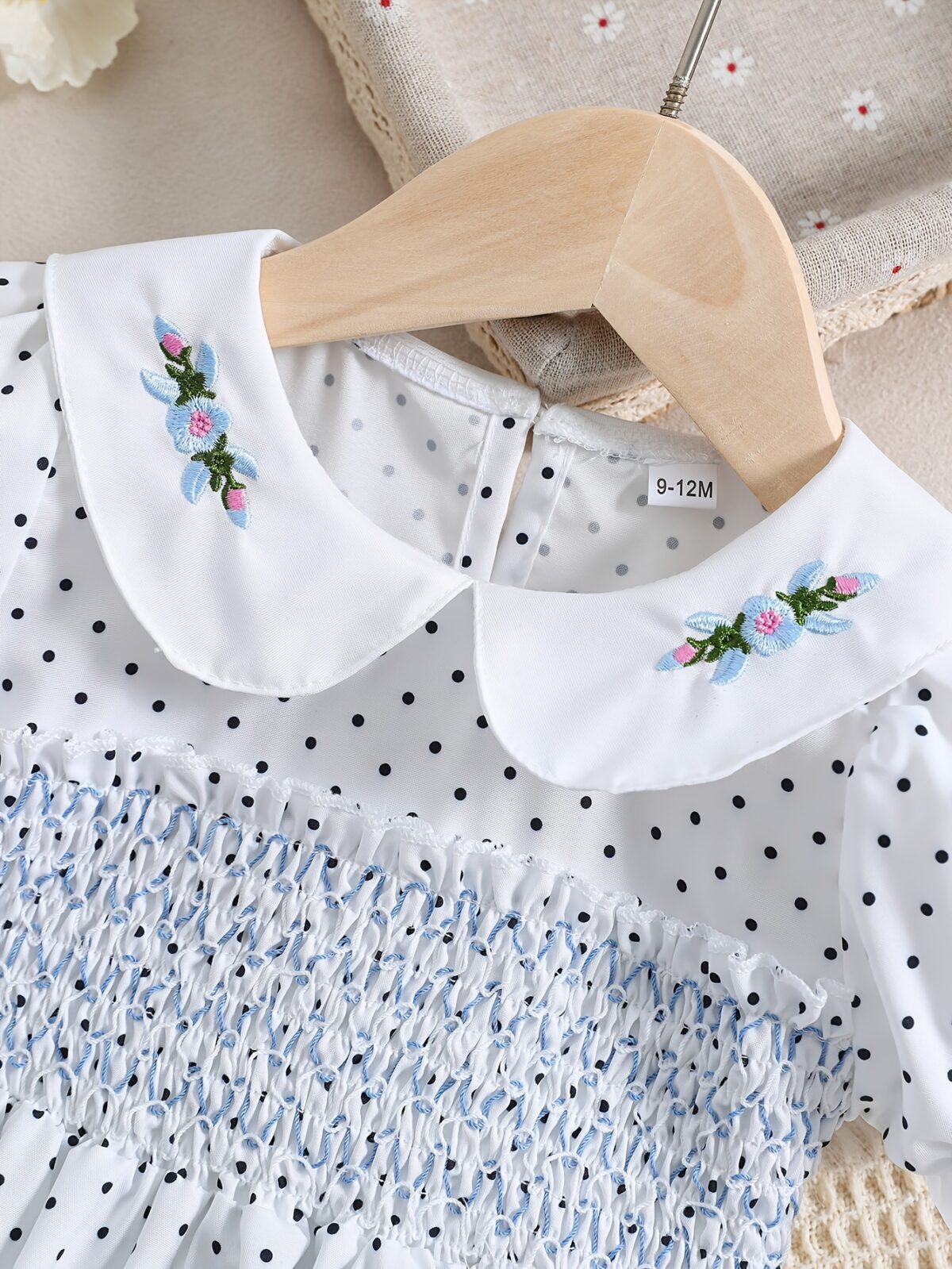 Adorable little girl twirling in a charming summer polka dot dress perfect for birthdays and special occasions