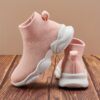 Stylish and comfortable Newness Cloudwalkers Kids High Tops in action perfect for active play A childs feet are shown wearing the high top sneakers while engaged in energetic activity