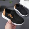 Stylish and comfortable blue canvas sneakers for boys perfect for playtime The shoes feature a classic design with durable construction