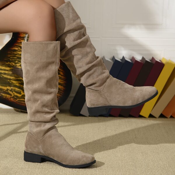Newness Slouchy Suede Mid Calf Boots in rich brown suede leather showcasing the comfortable slouchy fit and mid calf height Perfect for adding a touch of effortless chic to any winter outfit
