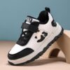 Adorable child wearing Newness Cozy Panda Kids Fleece Sneakers playing outdoors in the snow The sneakers are soft warm and feature a playful panda design