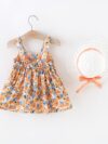 Baby girl wearing adorable Newness floral print dress and hat set perfect for summer