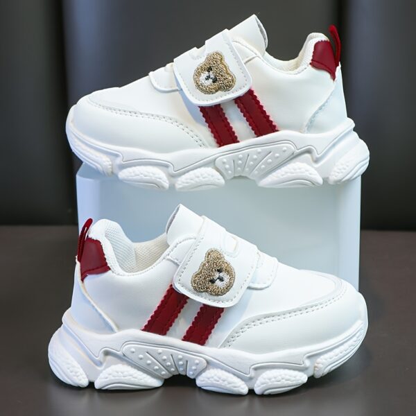 Adorable kids Playful Striped Sneakers with a cute bear charm showcasing Newnesss stylish and comfortable design