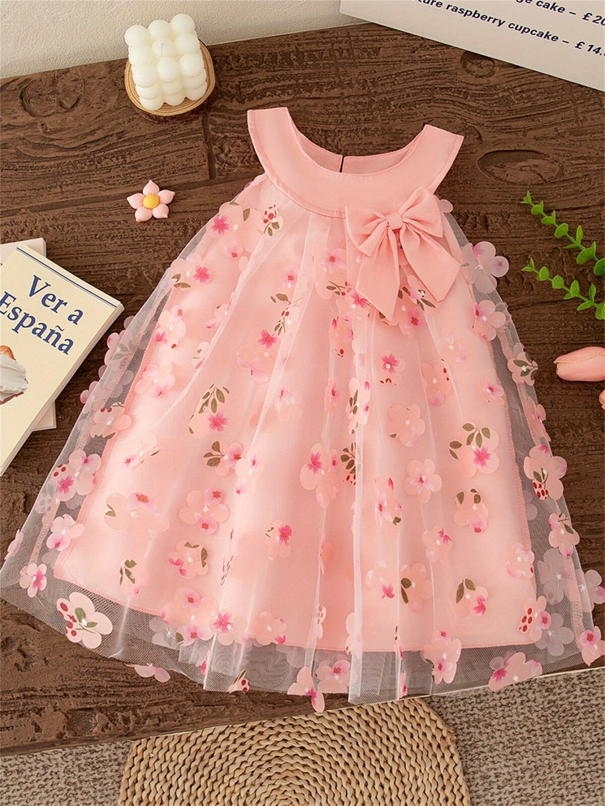Adorable little girl twirling in a beautiful rosebud garden floral print dress perfect for weddings or a casual day out