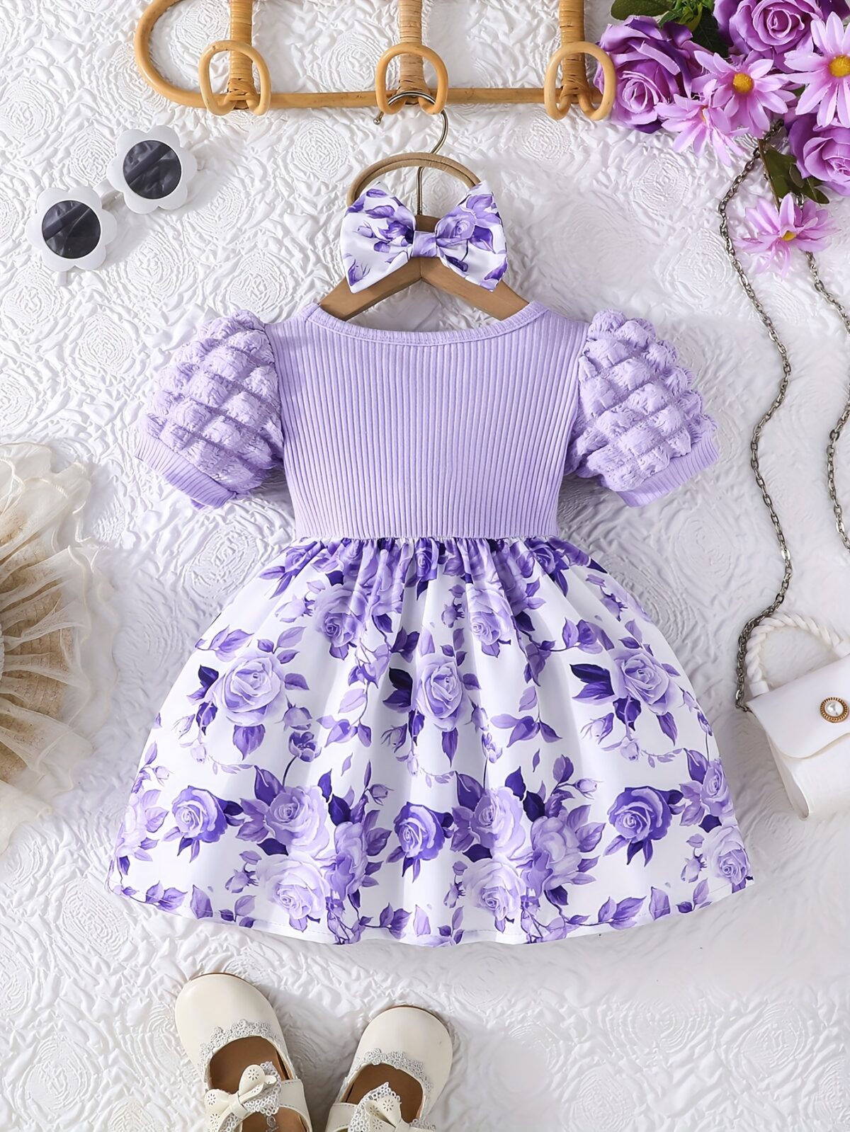 Adorable baby girl wearing a charming Seraphina floral print dress perfect for summer
