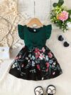 Adorable girl wearing a vibrant Summer Bloom floral print dress perfect for summer The dress features a playful colorful floral pattern