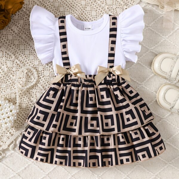 Baby girl wearing a charming two tone plaid summer dress perfect for playtime