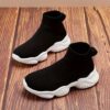 Stylish and comfortable Newness Cloudwalkers Kids High Tops in action perfect for active play A childs feet are shown wearing the high top sneakers while engaged in energetic activity