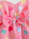 Adorable baby girl wearing a summer heart print dress perfect for school and special occasions