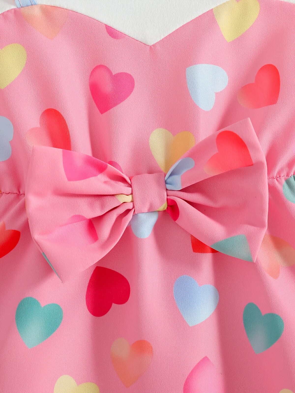 Adorable baby girl wearing a summer heart print dress perfect for school and special occasions