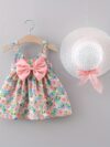 Baby girl wearing adorable Newness floral print dress and hat set perfect for summer