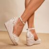 Newness Coastal Breeze Lace Up Wedge Sandals in white showcasing the intricate lace up detail and comfortable wedge heel perfect for summer
