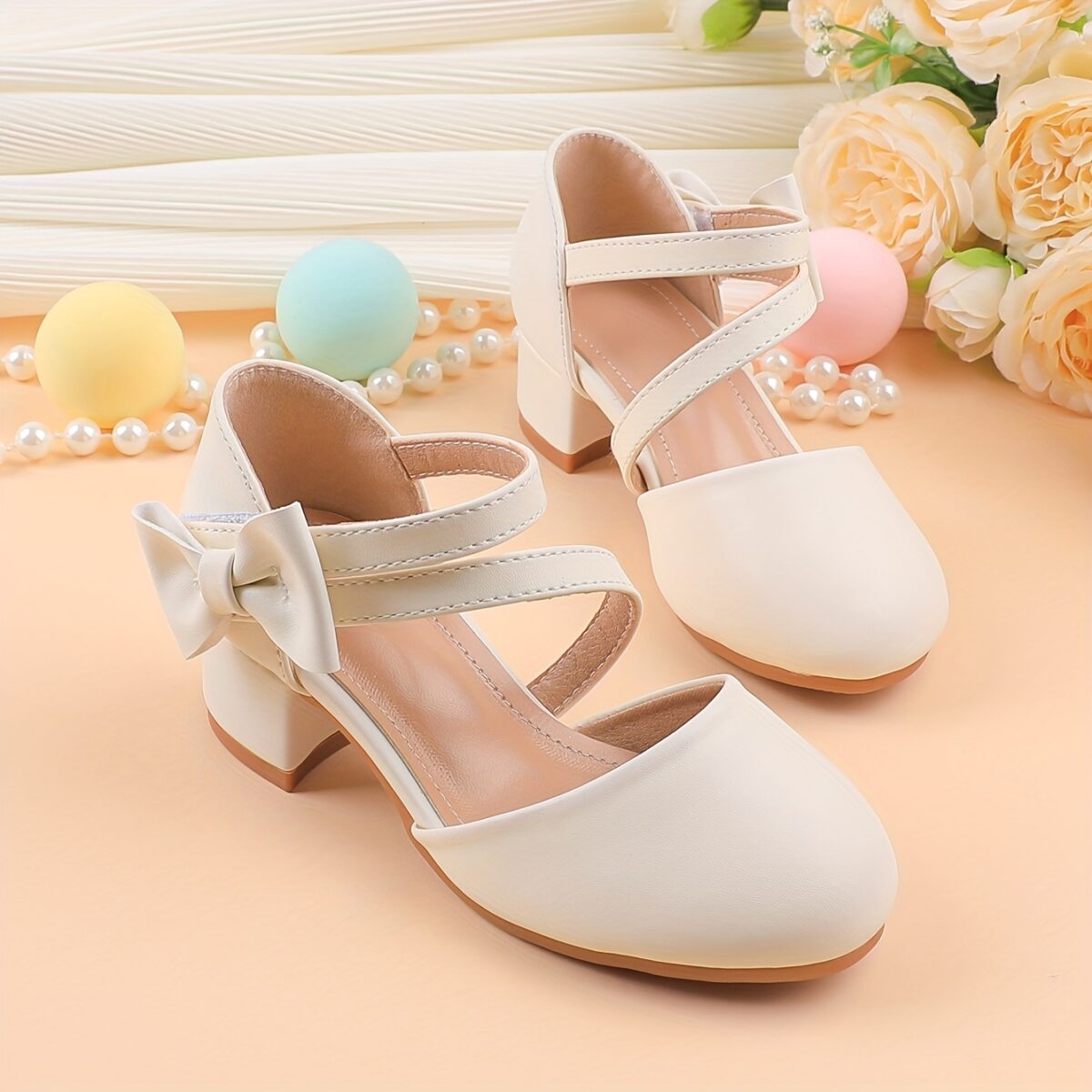 Adorable girls Mary Jane shoes with a delicate bow detail perfect for weddings parties and special occasions