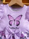Adorable baby girl in a lavender butterfly dress perfect for summer Newness
