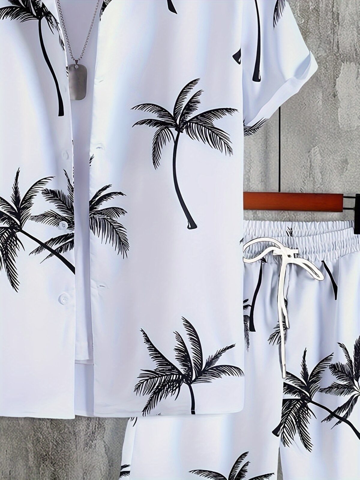 Embrace vacation vibes with the Newness Riviera Escape Palm Print Set This comfortable two piece set is crafted from lightweight polyester perfect for warm weather