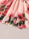 Adorable little girl twirling in a beautiful rose garden floral print dress Perfect summer outfit for kids
