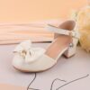 Adorable girls Pearl  Bow Mary Janes in white perfect for weddings parties and special occasions Featuring delicate pearls and charming bows