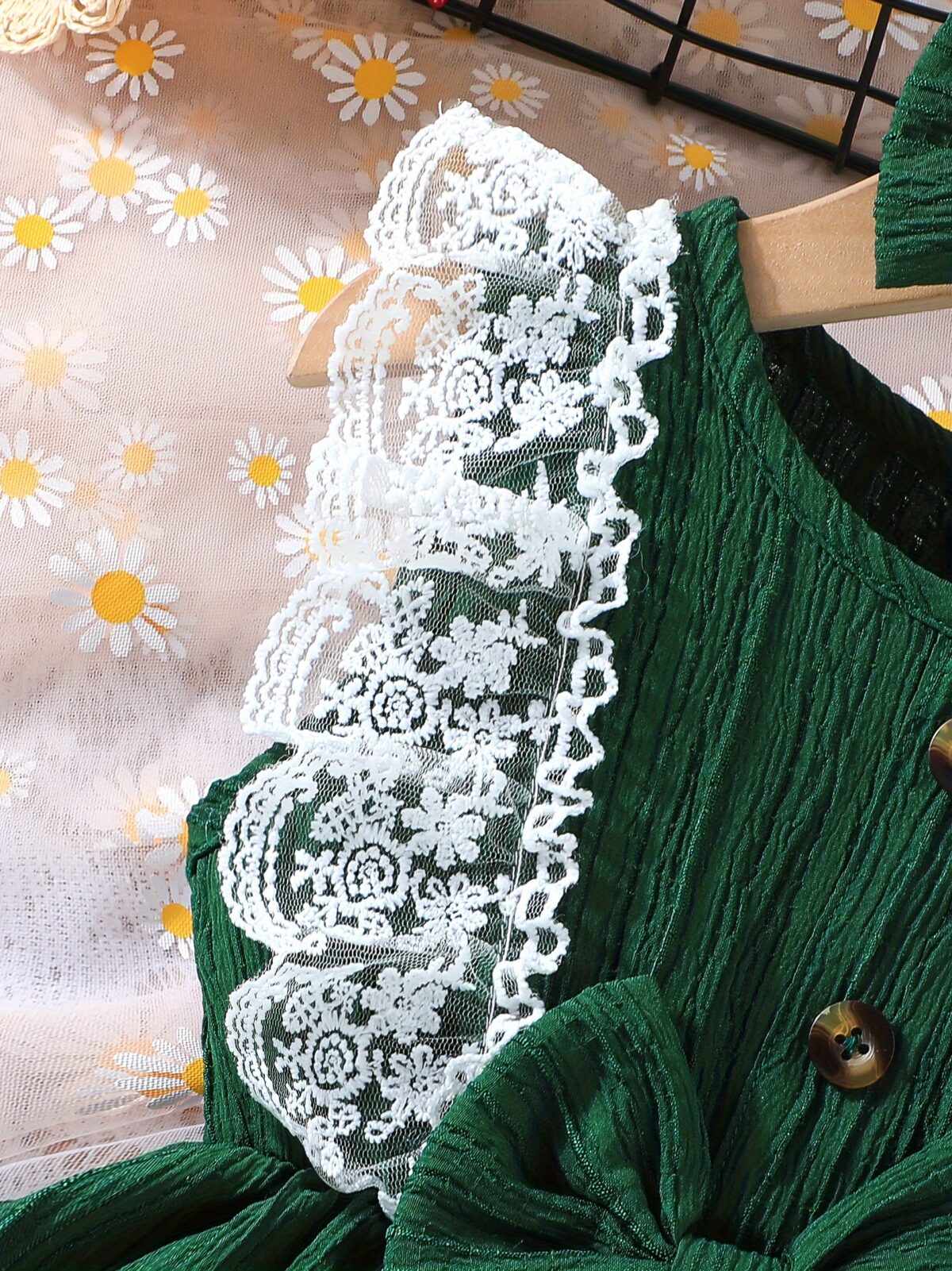 Toddler girl wearing a charming emerald green summer dress ideal for playing outdoors
