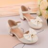 Adorable girls Pearl  Bow Mary Janes in white perfect for weddings parties and special occasions Featuring delicate pearls and charming bows