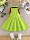 A little girl smiles while wearing a vibrant lime green dress Perfect summer outfit for girls