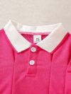 Adorable baby girl in a charming rose patterned summer dress perfect for playdates or special occasions