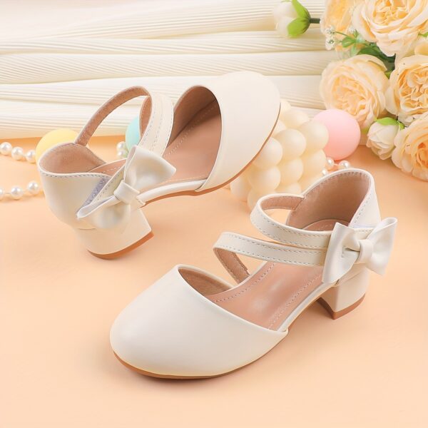 Adorable girls Mary Jane shoes with a delicate bow detail perfect for weddings parties and special occasions