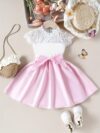 Adorable girl wearing a white Summer Bloom Lace Trim Dress showcasing its delicate lace details and summery style